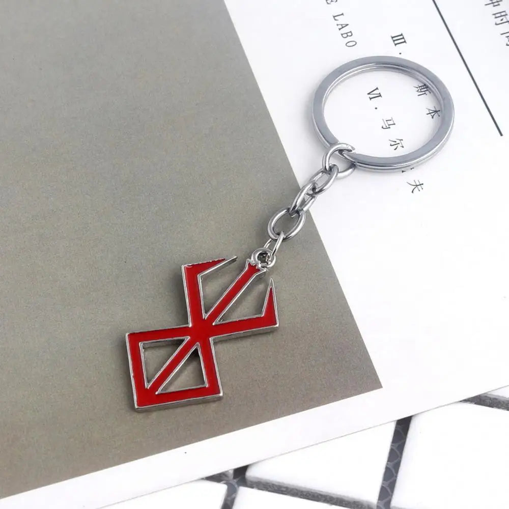 Japanischer Anime-Spiel-Schlüsselanhänger aus roter Emaille – Anhänger mit Berserker-Symbol aus Legierung, Cosplay-Schmuck und Wikinger-Geschenk